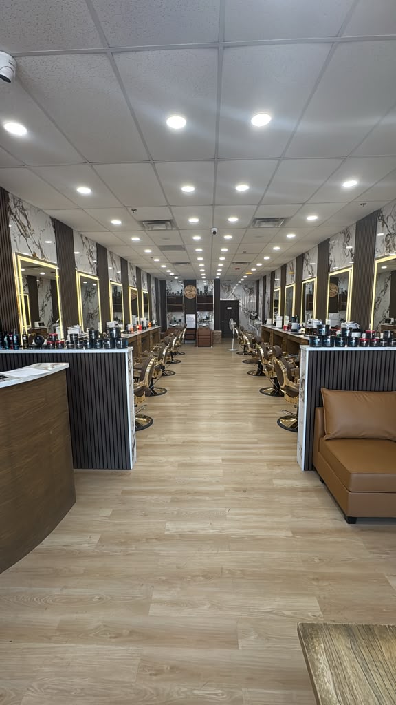 Barber giving a precision fade haircut at Fade & Style Barbershop in Allen, TX